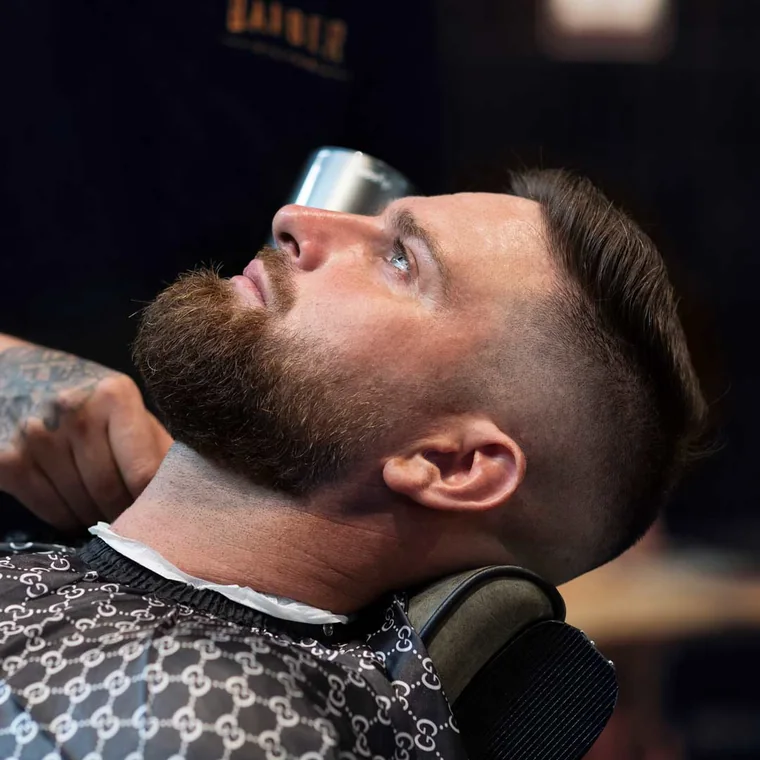 Beard shaping with a hot-towel finish