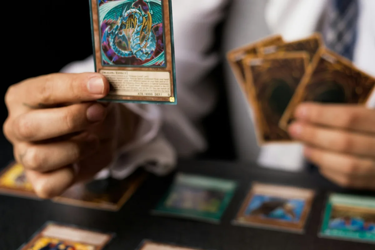 A collector sorting trading cards across a table
