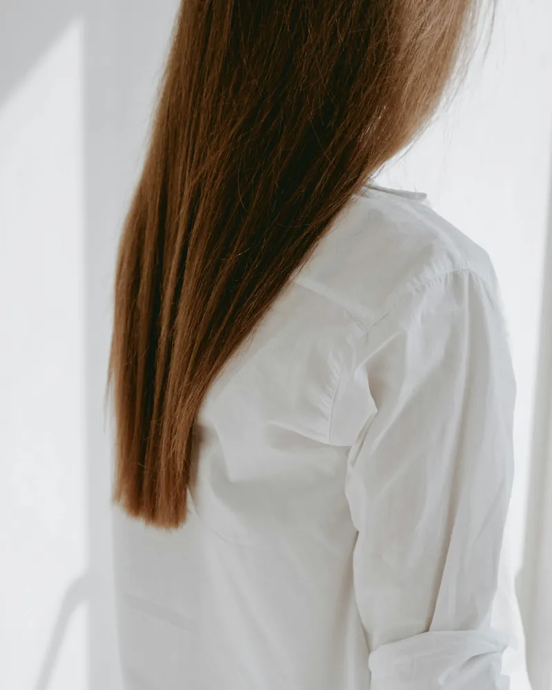 Long straight hair viewed from behind in daylight