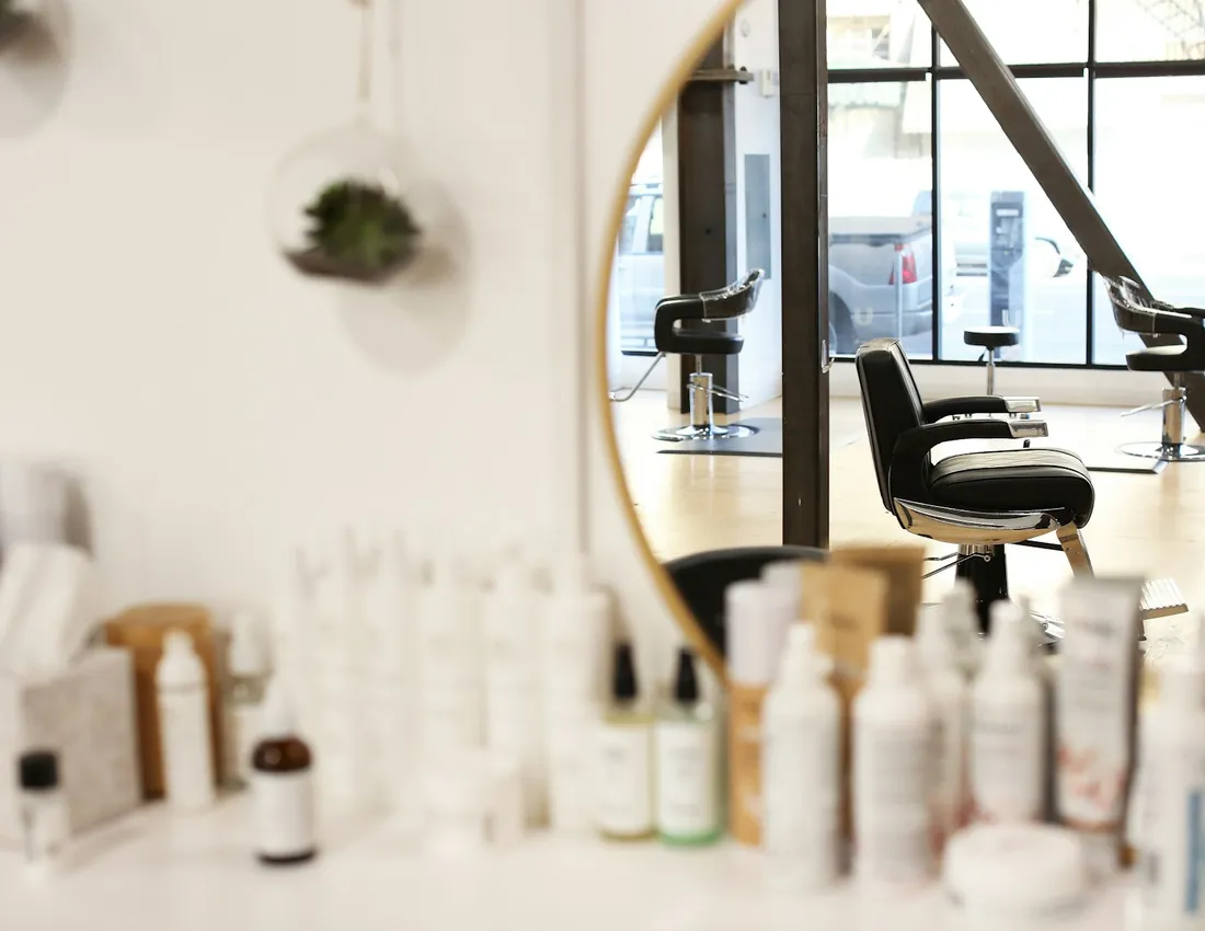 Bright salon studio interior with mirrors and styling stations