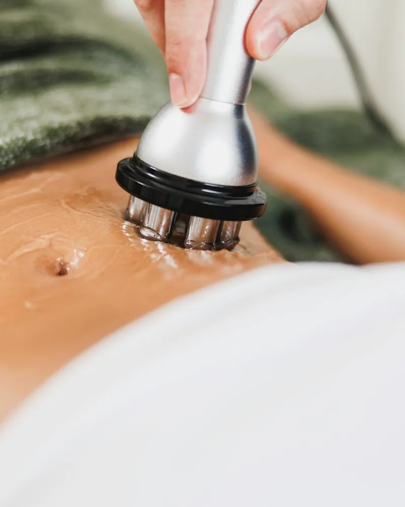 Non-invasive body contouring treatment applied to the abdomen
