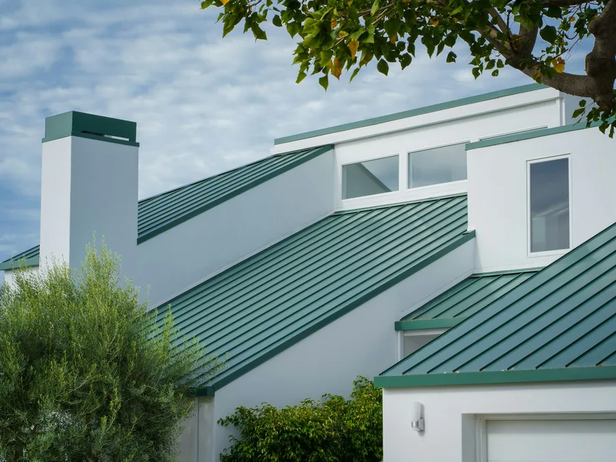 Standing seam metal roof on a modern white house