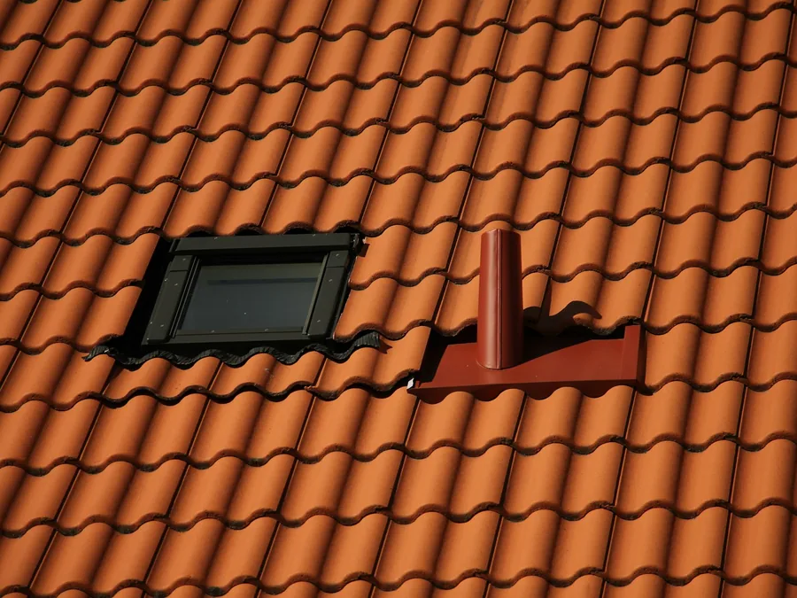 Terracotta barrel tile roof with a skylight