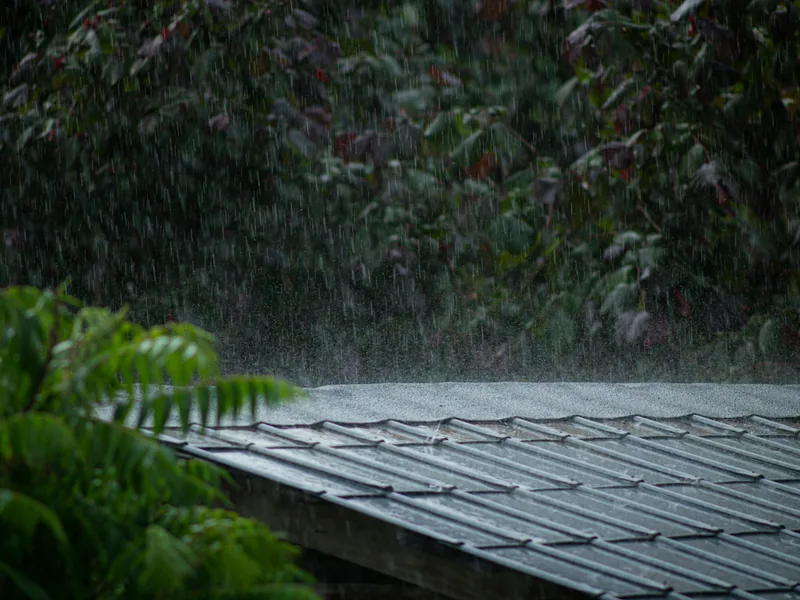 Heavy rain running off a residential roof