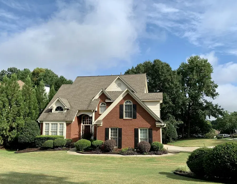 Brick home with a newly finished architectural shingle roof