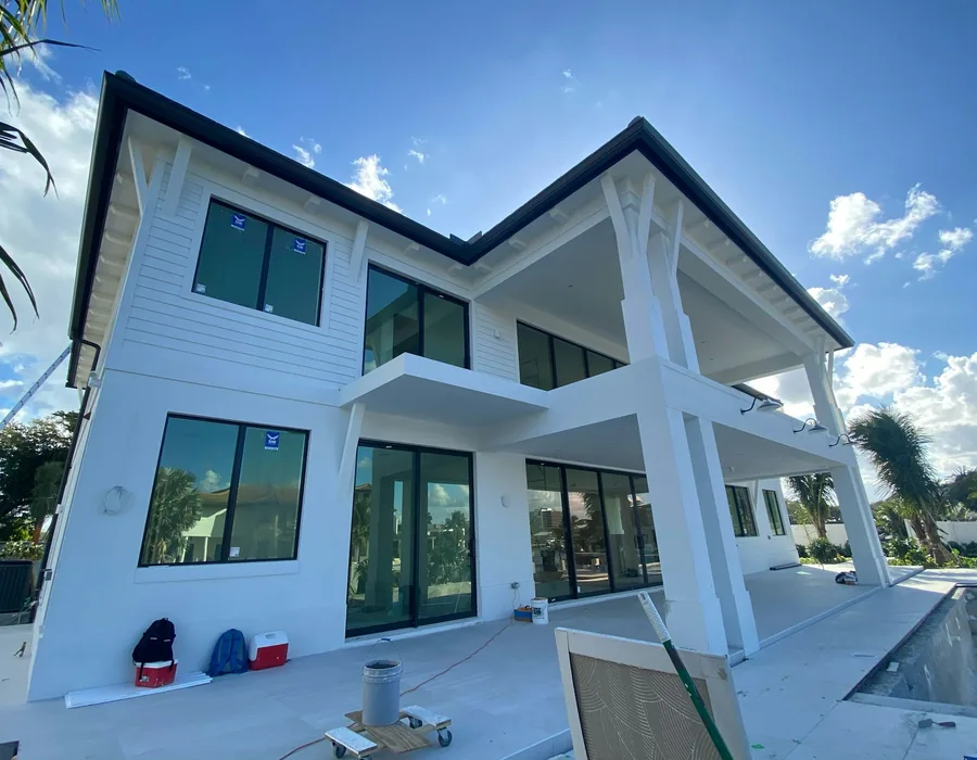 Modern two-storey white house with a new flat roof line
