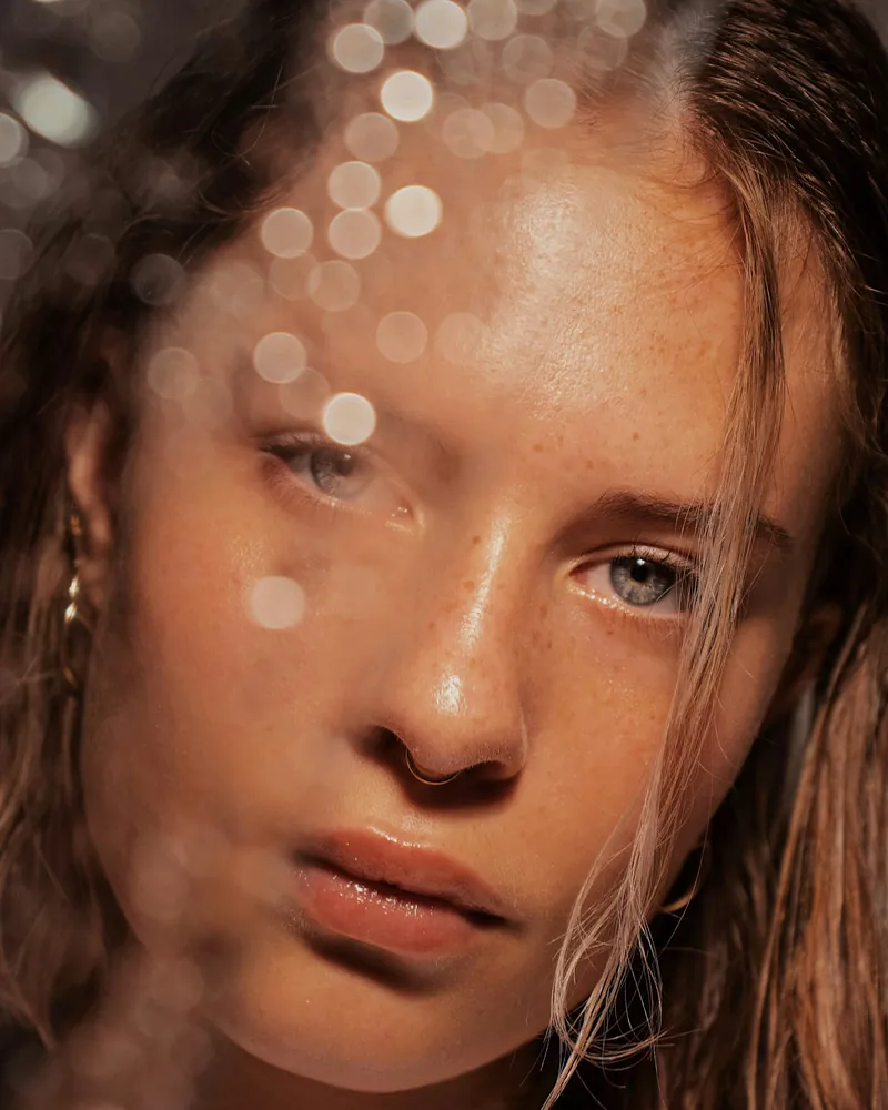 Portrait of a person with freckled, unretouched skin in daylight